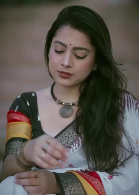 White dolla printed saree.