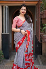 Grey/red ajrakh style saree.