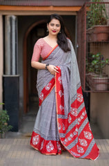 Grey/red ajrakh style saree.