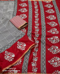 Grey/red ajrakh style saree.