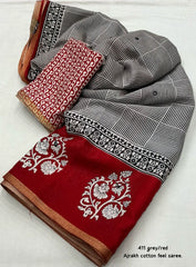 Grey/red ajrakh style saree.