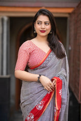 Grey/red ajrakh style saree.