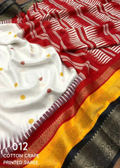 White dolla printed saree.
