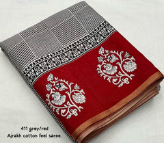 Grey/red ajrakh style saree.