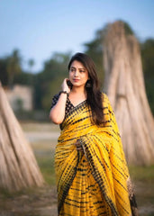 Yellow tye & dye shibori saree.